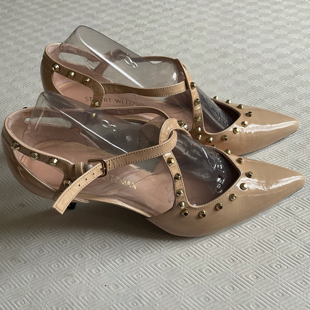 Gold studded nude Stuart Weitzman heels.